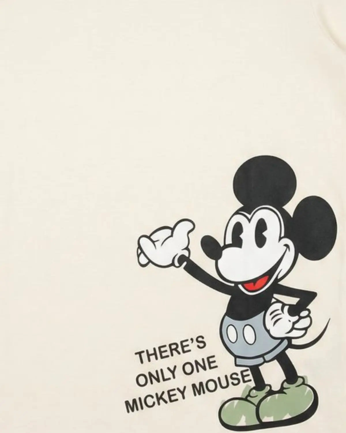 Boys short sleeve cream graphic tee with cartoon character design.