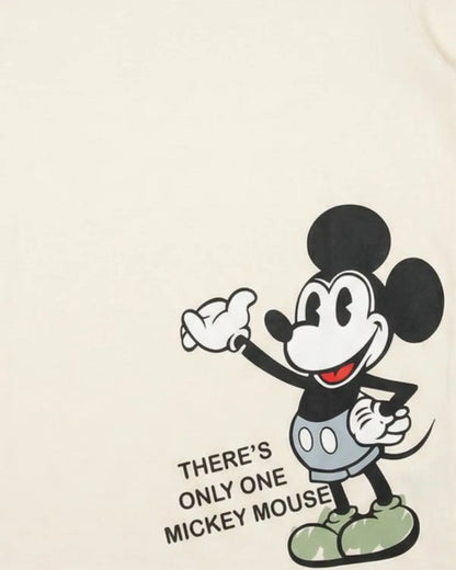 Boys short sleeve cream graphic tee with cartoon character design.