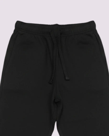 Black sweatpants with drawstring on a light gray background