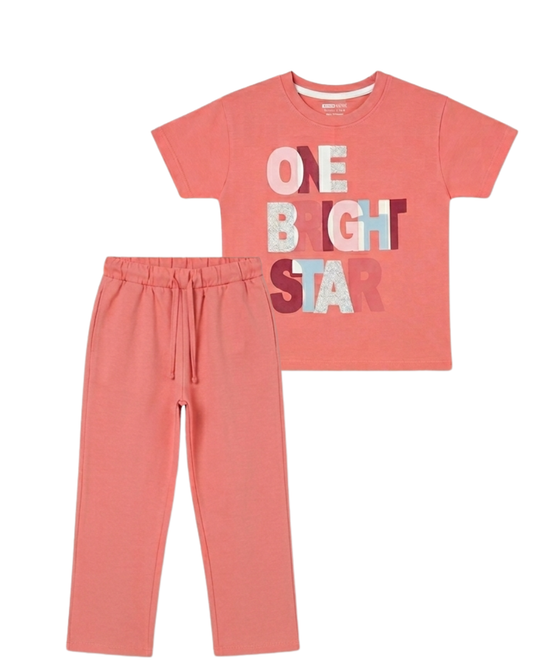 Coral pajama set with 'One Bright Star' text on a white background