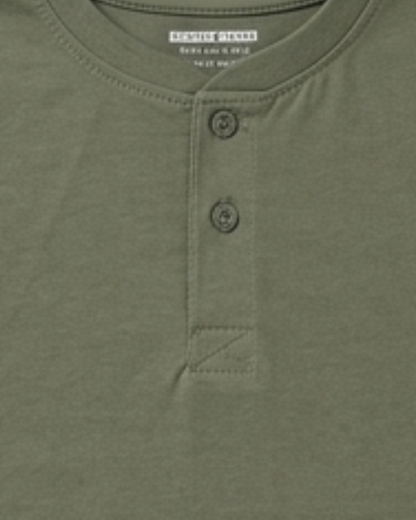 Close-up of a green henley shirt with button details, featuring the brand 'Goodthreads'.