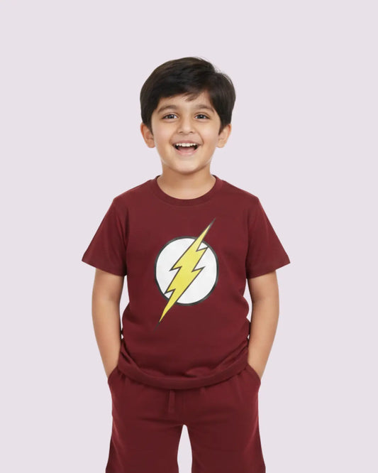 Child wearing a maroon t-shirt with a lightning bolt design