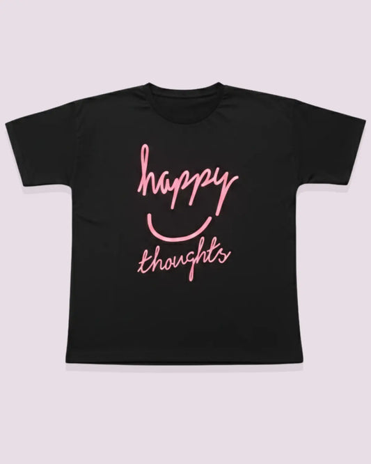 Black t-shirt with pink 'happy thoughts' text on a light gray background