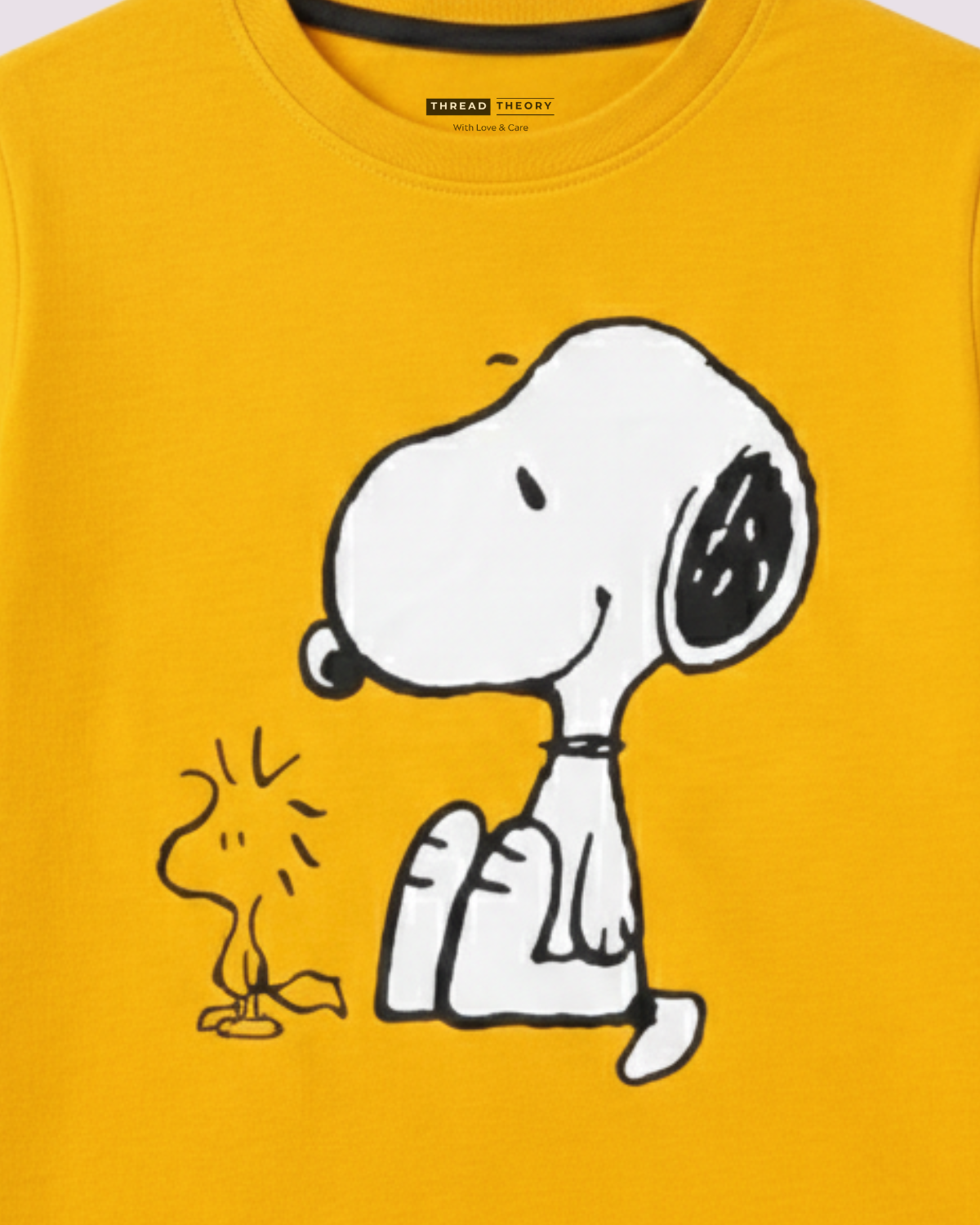 Yellow cotton kids t-shirt with cartoon dog illustration on front.
