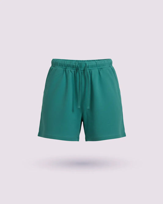 Green shorts on a light gray background