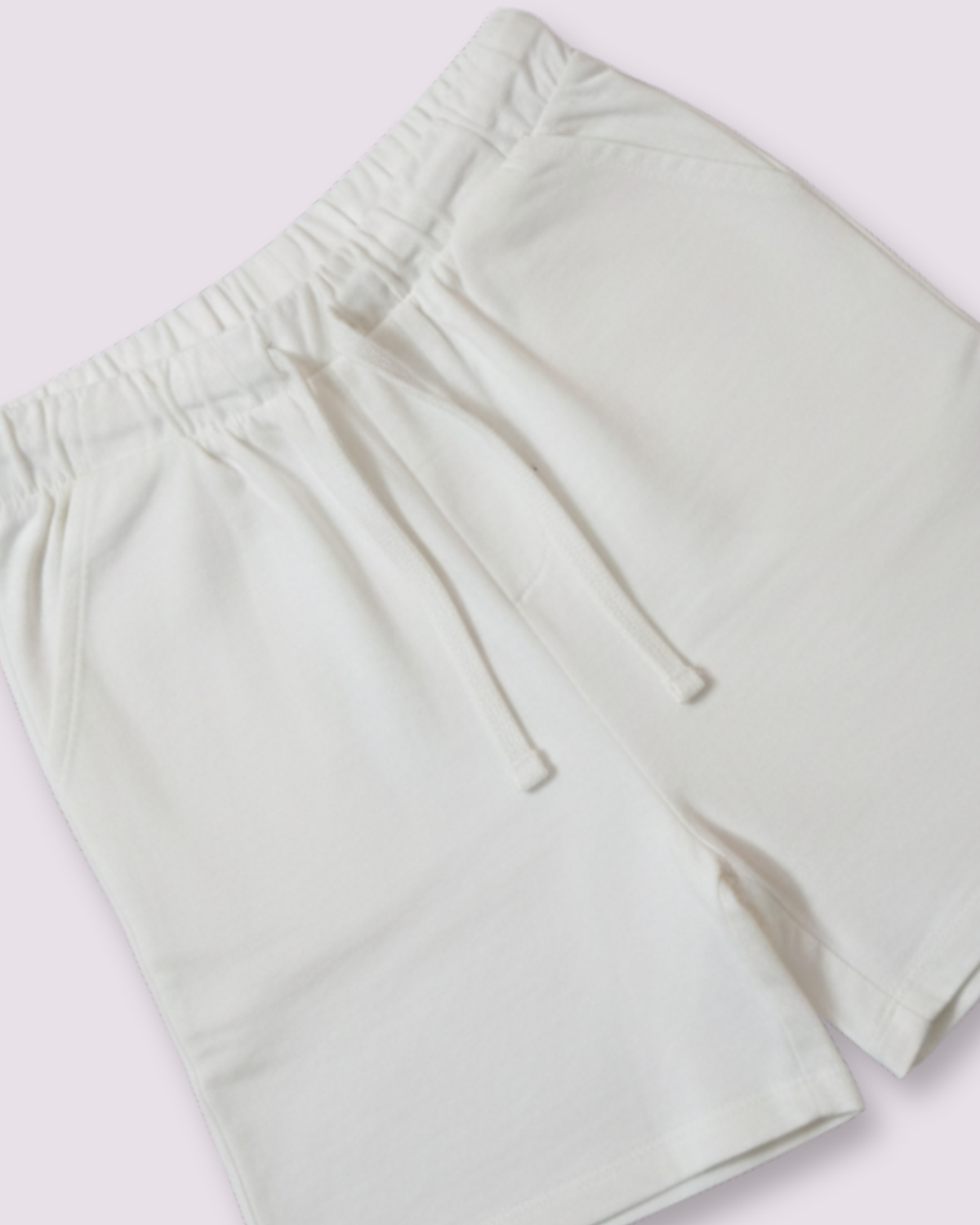 Off-white cotton shorts for boys with elastic waistband and drawstring